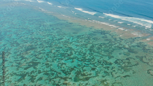 Aerial view of the beautiful ocean floor with reefs near Pantai Pandawa. Indonesia.