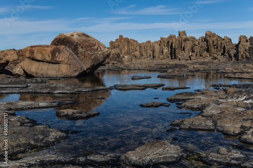 Bombo Headland Quarry Australia. Blue skies and reflections in water