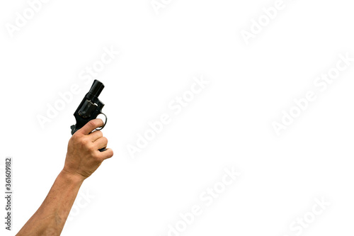 Isolated hand holding a gun ready to shoot