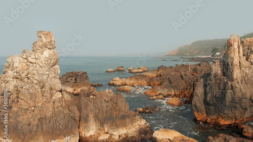 Aerial view rocks and stones on the Arambol beach in North Goa, India. photo