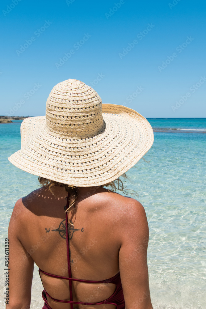 Woman with Straw Hat and Tropical Water