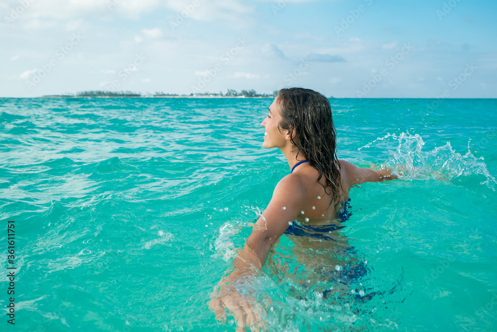 Woman Splashing in Tropical Water