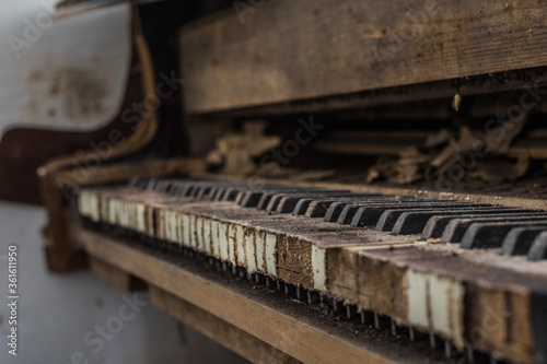 dusty keys from a piano in a old house
