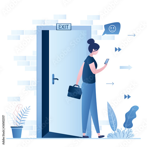 Businesswoman leaves office, end of working day. Brick wall, open door and plate-exit. Happy woman employee chatting on smartphone.