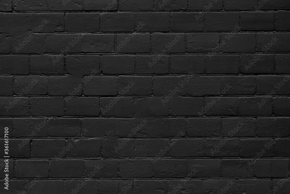 Black brick wall. Texture of black bricks for modern interior.