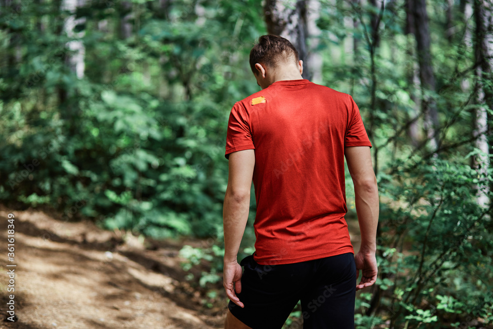 Young man running alone on an empty road Young man running alone on an empty road