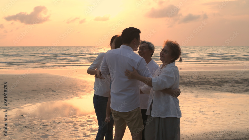 Family concept. Parents and children meet grandparents at the seashore. 4k Resolution.