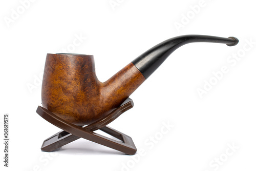 Smoking briar pipe on a white background