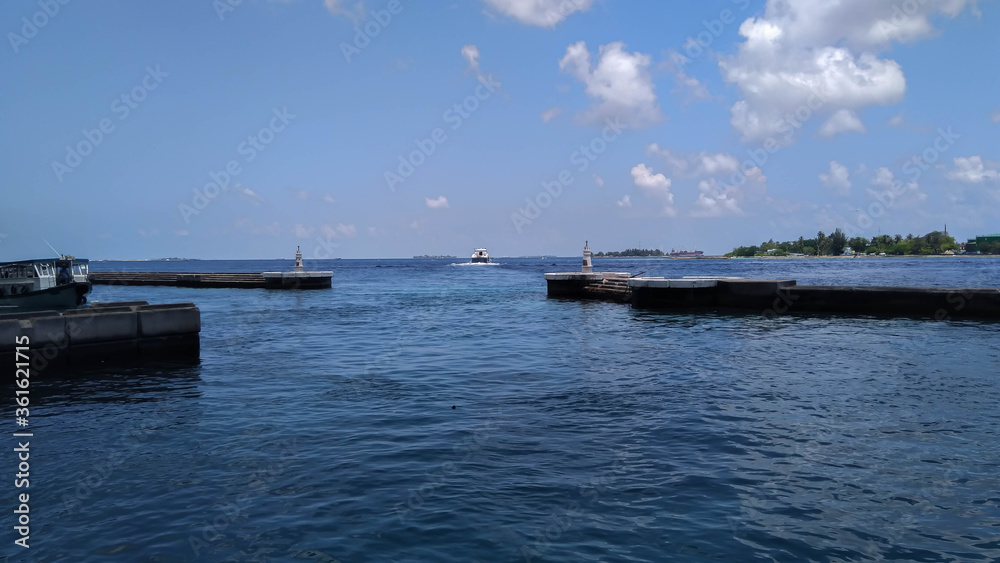 Boats at the harbor next to Ibrahim Nasir International Airport in Male, Maldives. Summer Holidays in Southeast Asia. 