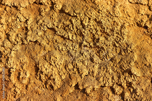 Texture of different layers of clay on the edge of a cliff. Closeup