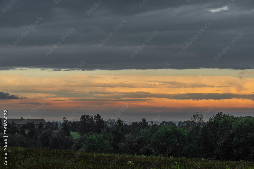 Sunset in hot summer rainy evening near Roprachtice village