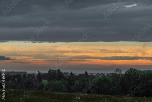 Sunset in hot summer rainy evening near Roprachtice village