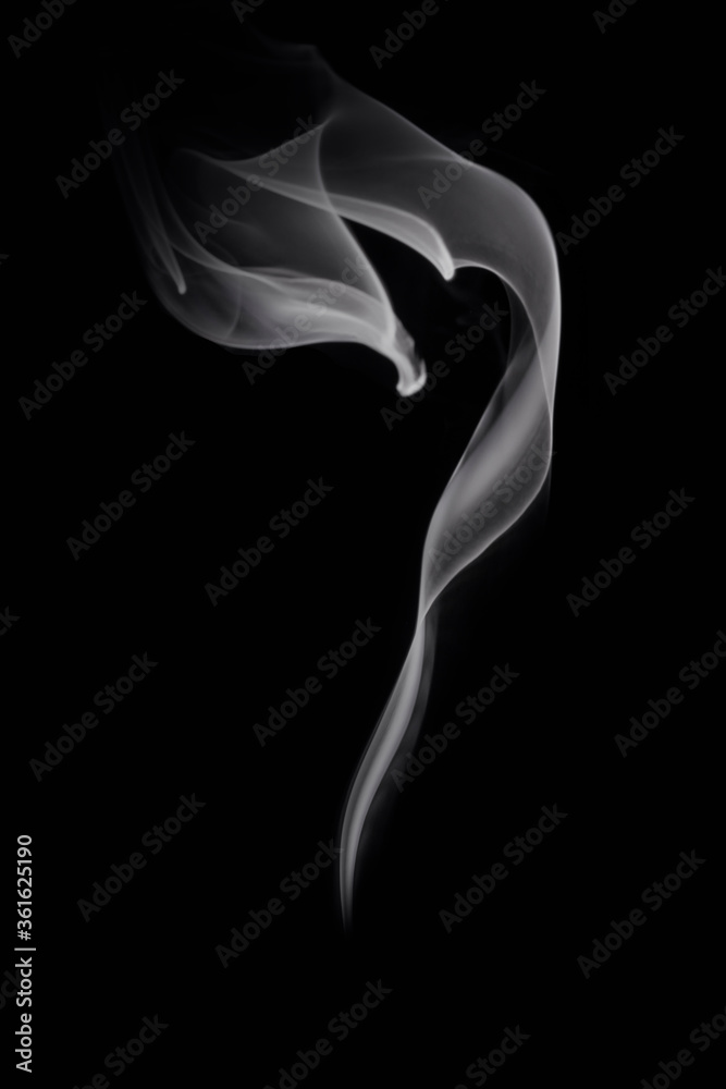 Abstract white smoke or steam swirls on black background Abstract white smoke or steam swirls on black background