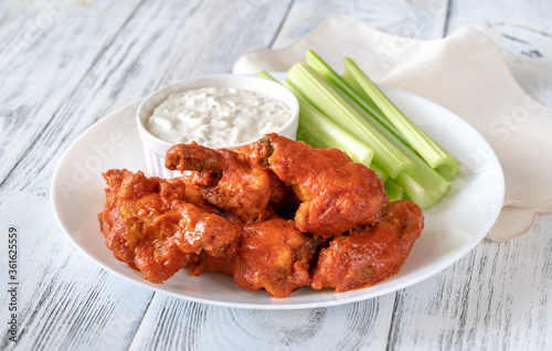 Bowl of buffalo wings with blue cheese dip