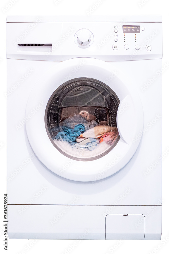 Laundry in a washing machine. Automatic washing machine. Isolate on a white background. Front view Laundry in a washing machine. Automatic washing machine. Isolate on a white background. Front view