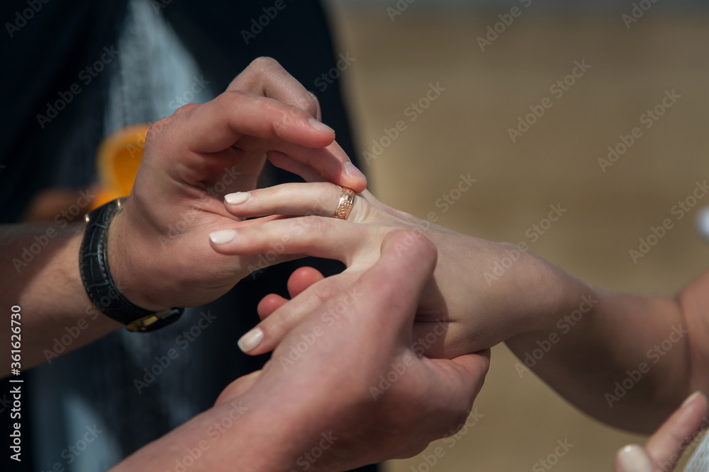 wedding ceremony on the ocean in Morocco, exchange of rings