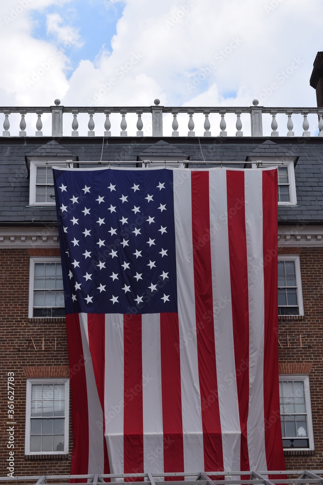 A large American flag hanging