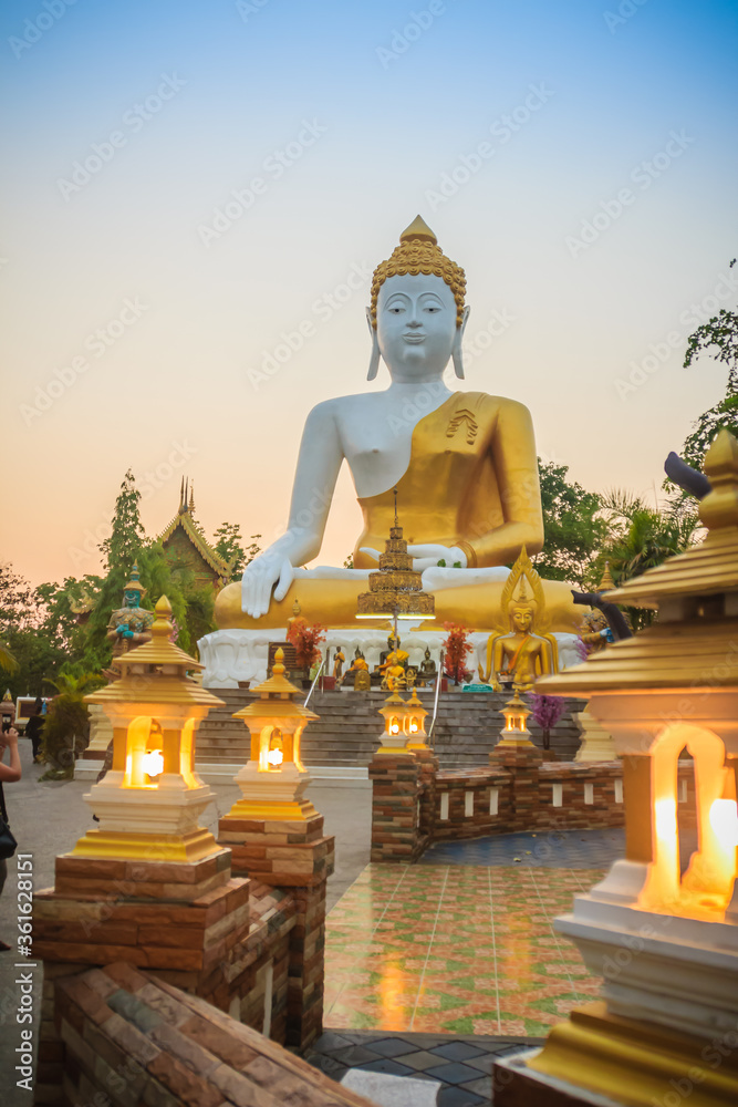 Beautiful big buddha image at Wat Phra That Doi Kham. Chiang Mai, Thailand. Wat Phra That Doi Kham (Wat Doi Kham or the Golden temple) is located at the top of a hill to the south west of the city. Beautiful big buddha image at Wat Phra That Doi Kham. Chiang Mai, Thailand. Wat Phra That Doi Kham (Wat Doi Kham or the Golden temple) is located at the top of a hill to the south west of the city.