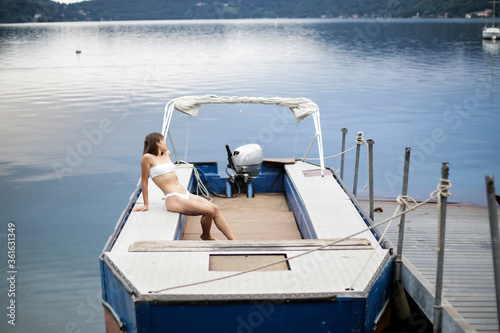 Young woman on the boat photo