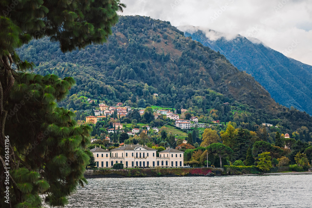 Villa on the shore of lake Como against the backdrop of the majestic Alpine mountains. Quiet and cozy place in the North of Italy. cenic landscapes of Lago di Como - Cadenabbia, Italy