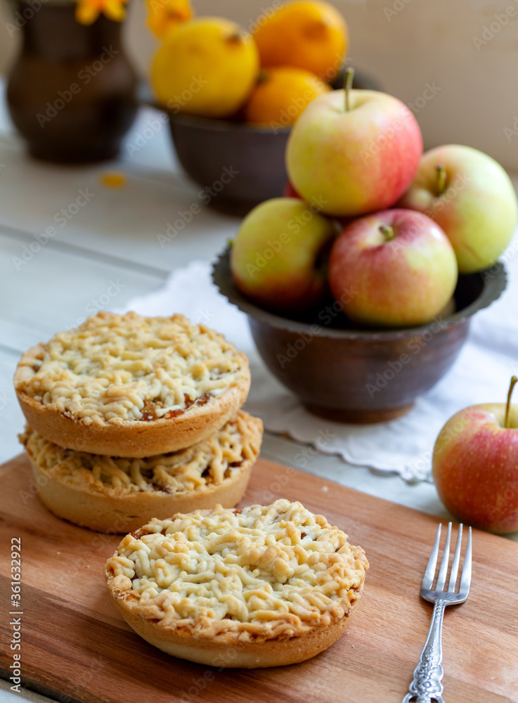 Pieces of delicious apple pie on wooden background Pieces of delicious apple pie on wooden background