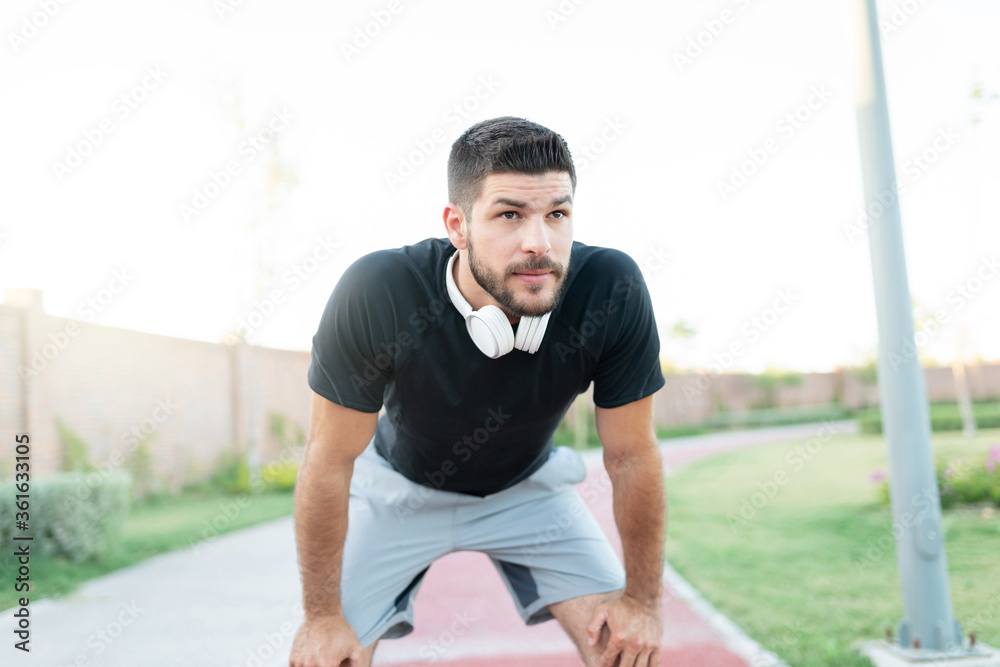 Sporty Man Taking Break During Workout