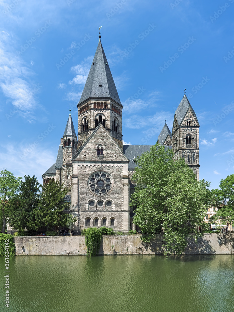 Metz, France. Temple Neuf (New Temple), a Protestant city church at the island of Petit-Saulcy on the Moselle river. The church was built in 1901-1904 in the Neo-Romanesque style. Metz, France. Temple Neuf (New Temple), a Protestant city church at the island of Petit-Saulcy on the Moselle river. The church was built in 1901-1904 in the Neo-Romanesque style.