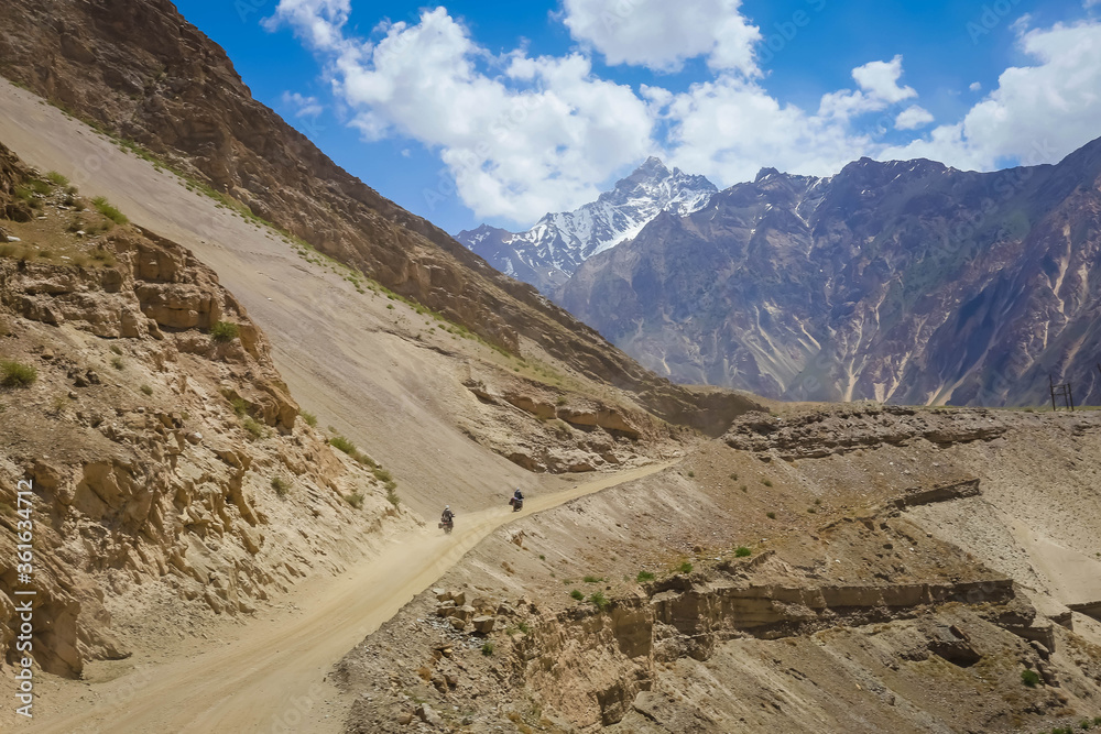 road in the mountains with two bikers road in the mountains with two bikers
