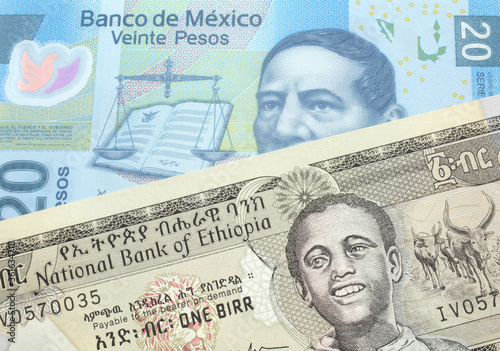 A one birr note from Ethiopia in macro with a twenty Mexican peso bank note close up