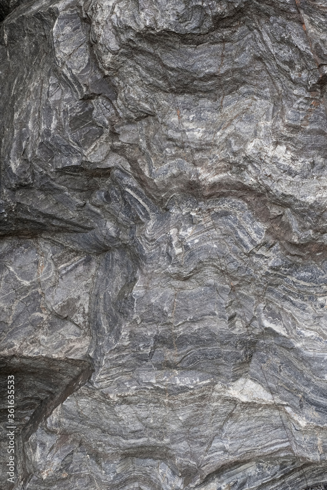 Background of untreated granite. The pattern and texture of the granite layers. Natural background. 