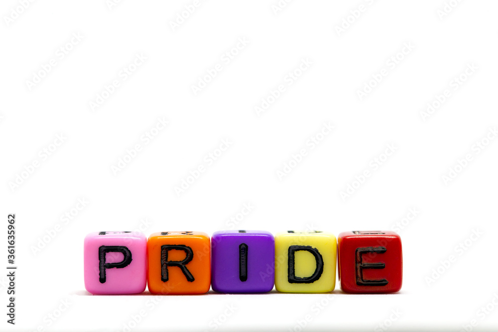 PRIDE word written on various rainbow cubes isolated on white background, with colorful symbol of heart lgbt concept PRIDE word written on various rainbow cubes isolated on white background, with colorful symbol of heart lgbt concept
