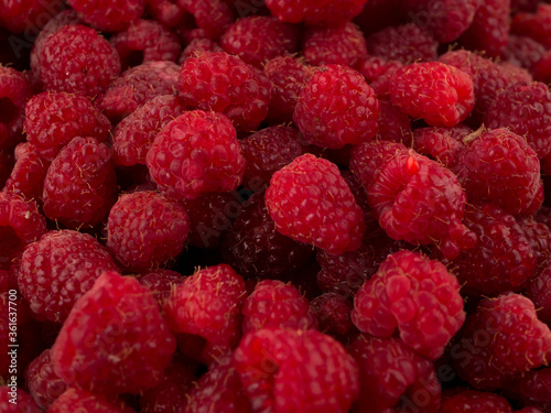 Fresh raspberries background closeup photo
