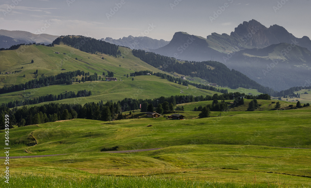 Alpe di Siusi/Seiser Alm, largest high altitude alpine meadow plateau in Europe and the Dolomites mountain ranges around, major tourist attraction, known for hiking & skiing, South Tirol, Italy. - obrazy, fototapety, plakaty 