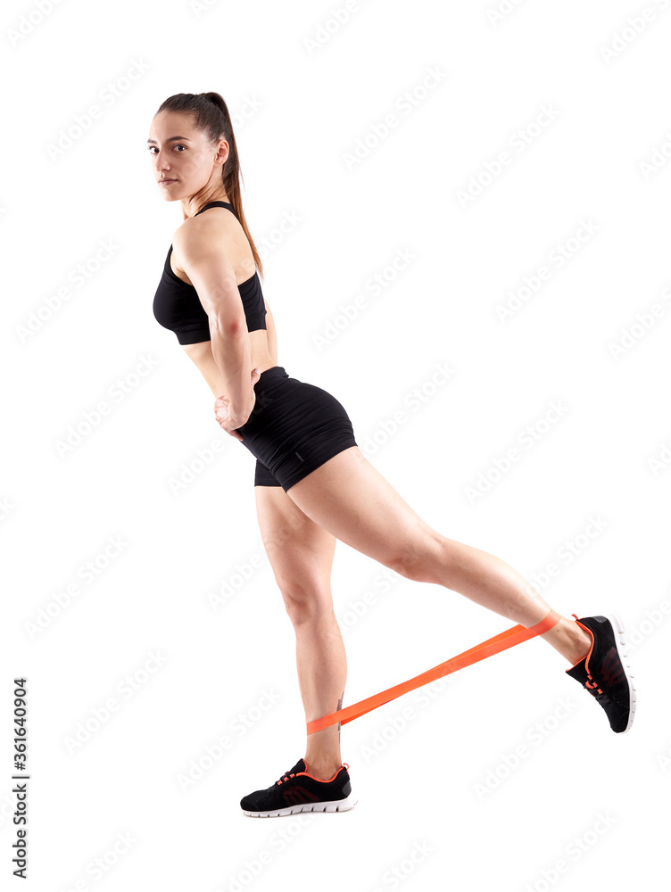 Athlete doing workout with elastic bands Athlete doing workout with elastic bands
