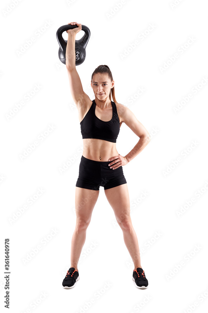 Fototapeta premium Woman working out with kettlebell