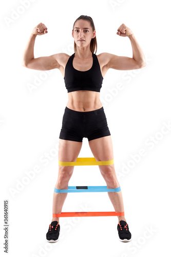 Athlete doing workout with elastic bands