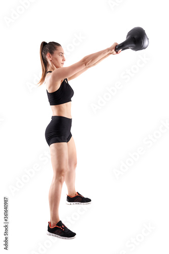 Woman working out with kettlebell © Xalanx