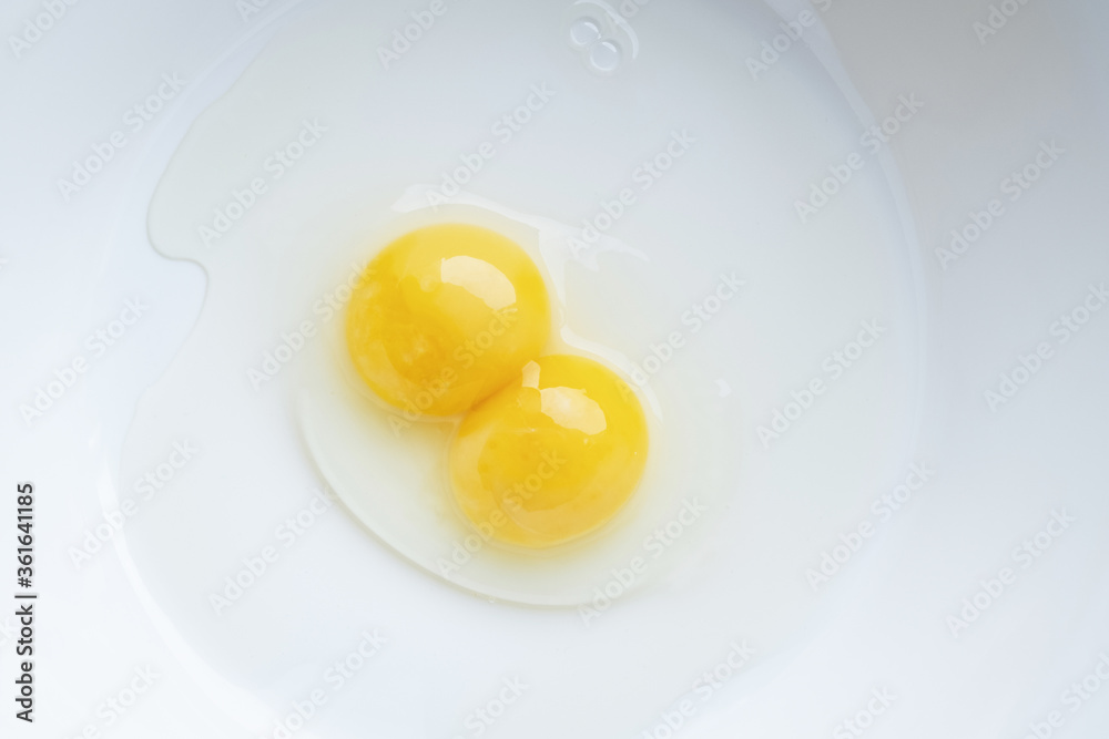 Double egg. Identical twins.. Two yolks in one chicken egg. Double egg. Identical twins.. Two yolks in one chicken egg.
