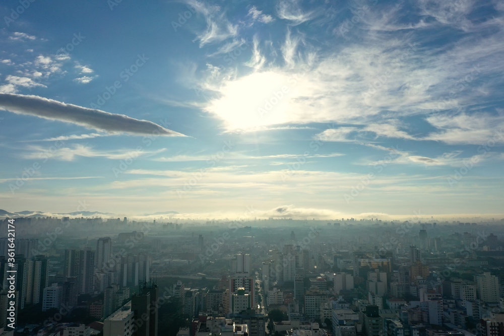 Fototapeta premium Foggy morning view in the urban city. Cityscape view. Fog landscape. Sunrise view. Foggy morning view in the urban city life scene, Sao Paulo, Brazil. Cityscape view. Fog landscape. Sunrise view. 
