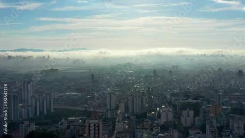 Wallpaper Mural Foggy morning view in the urban city. Cityscape view. Fog landscape. Sunrise view. Foggy morning view in the urban city life scene, Sao Paulo, Brazil. Cityscape view. Fog landscape. Sunrise view.  Torontodigital.ca