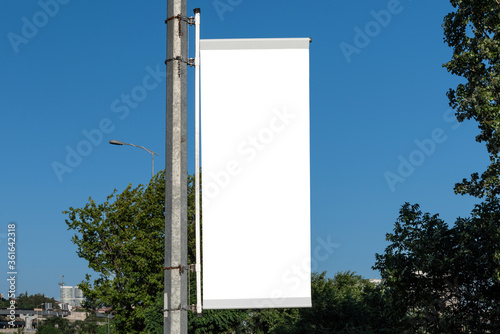 The blank advertising pole banner on the street.