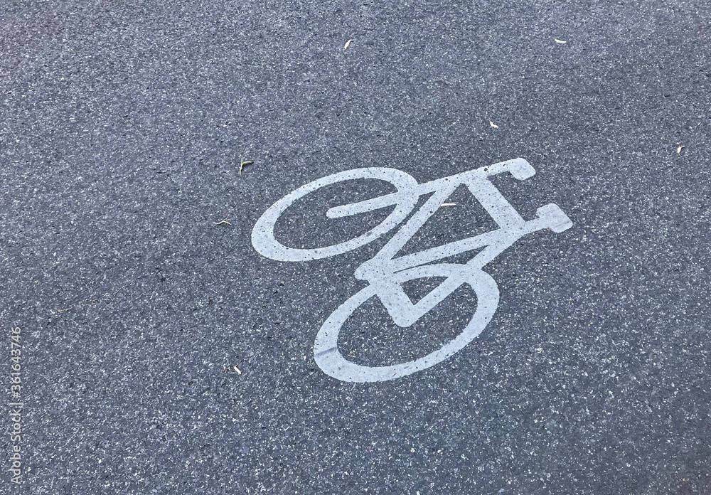 Fototapeta premium bicycle lane sign on asphalt