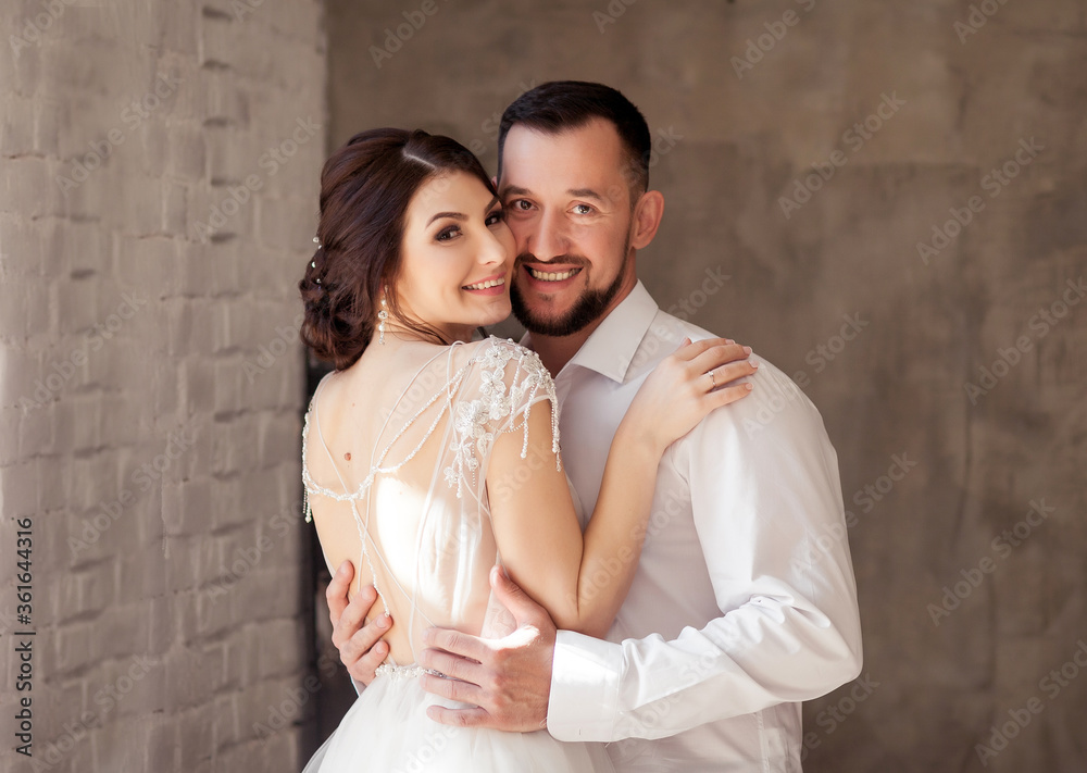 the bride helps the groom to dress