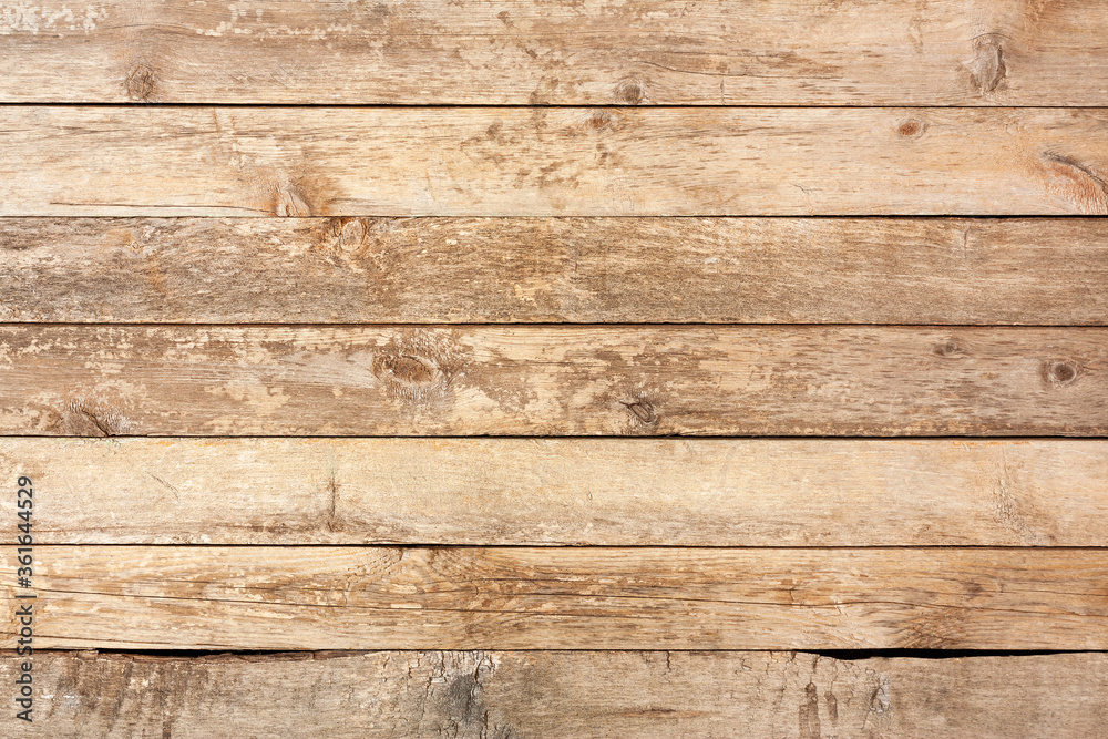 Wooden texture with horizontal planks background. Light brown old wooden boards close-up. Wooden texture with horizontal planks background. Light brown old wooden boards close-up.