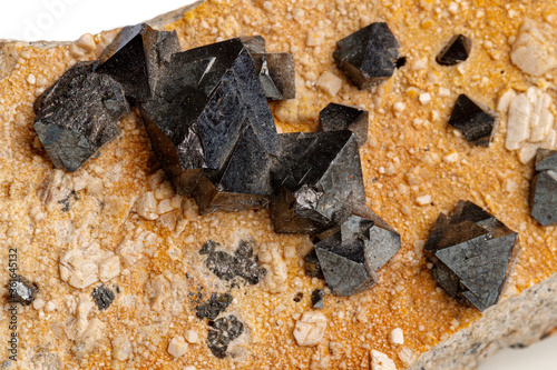 Fotografie Macro Magnetite mineral stone on a white background