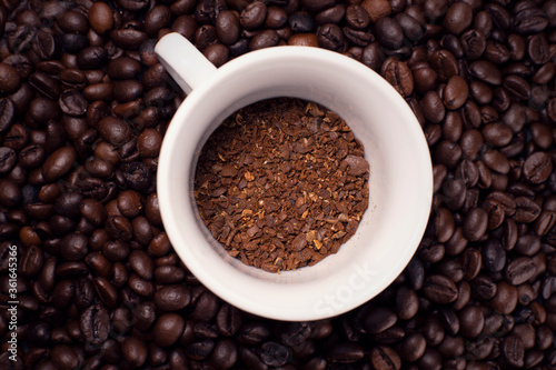 coffee cup with coffee beans table outside