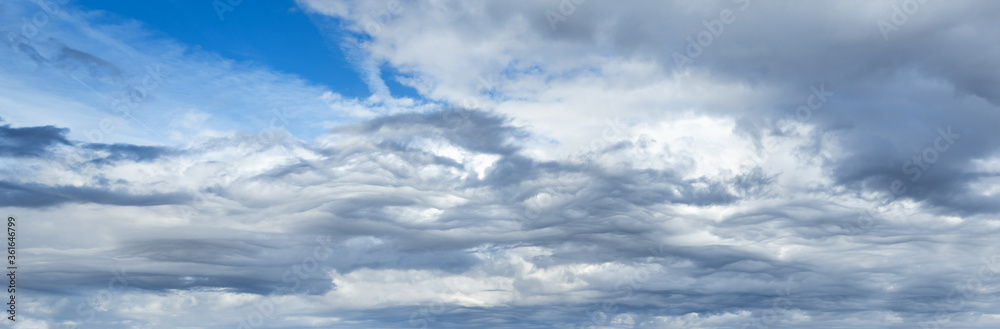Fototapeta premium Clouds in the overcast sky view. Climate, environment and weather concept sky background.