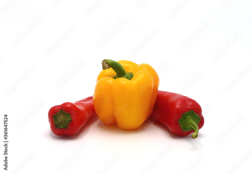 Composition of yellow and red sweet peppers of different sizes on a light background. Natural product. Natural color. Close-up. Composition of yellow and red sweet peppers of different sizes on a light background. Natural product. Natural color. Close-up.