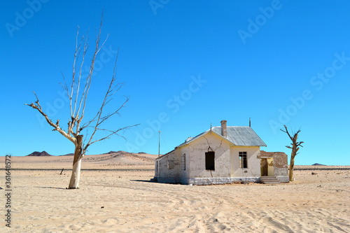 A railway station in Kolmanskop, stands abandoned in the desert, in the sand, Namibia