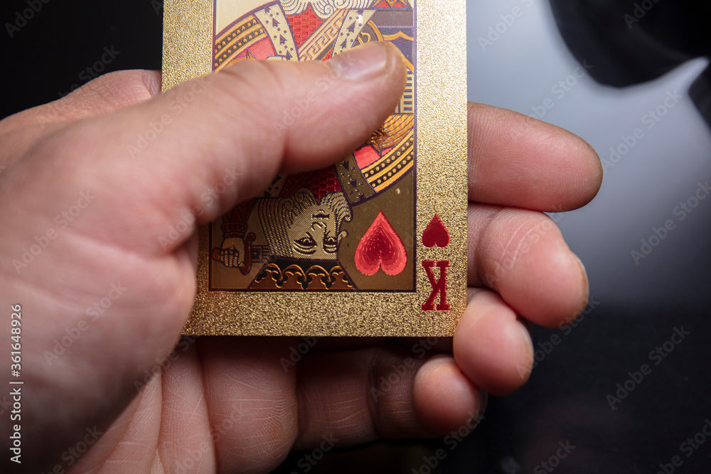 Fototapeta premium Golden poker card and gambling issue